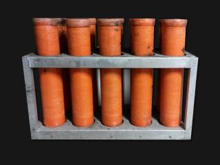 Mortar rack with 4 inch mortar tubes for rent. 10 tubes per rack. Available for rent at Xena Vuurwerk, professional fireworks supplier